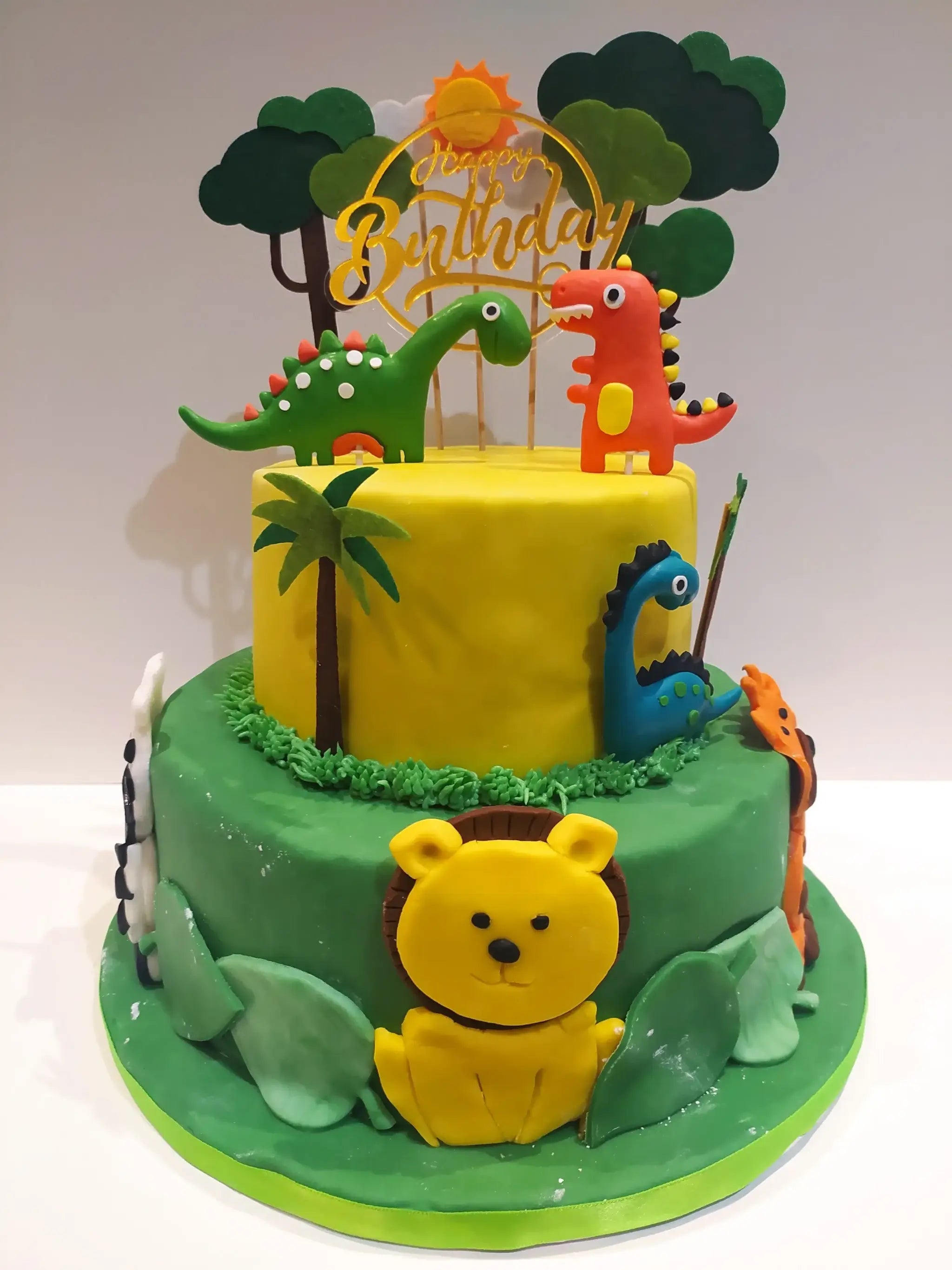 Dinosaur and animal 2 tier birthday cake
